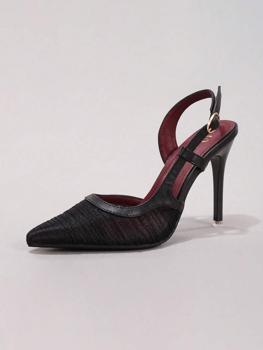Black lace pointed toe high heel pumps featuring stiletto heels and a decorative bow accent.