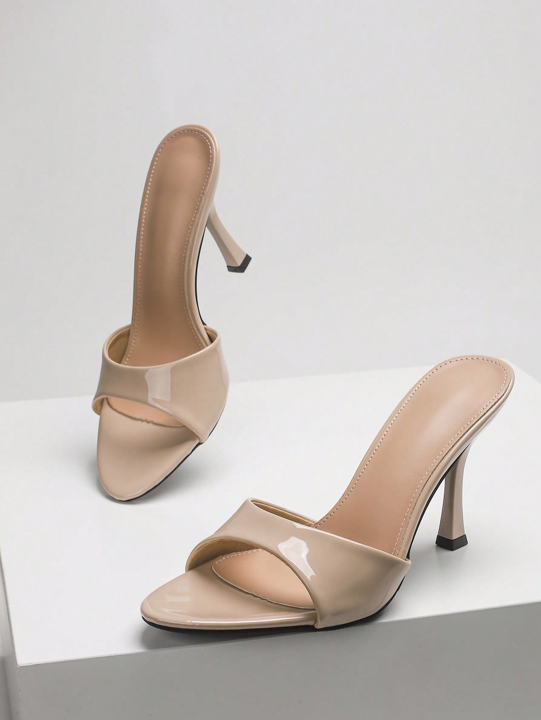 Women's open toe high heel sandals with slingback strap and sleek stiletto heel in smooth PU leather.