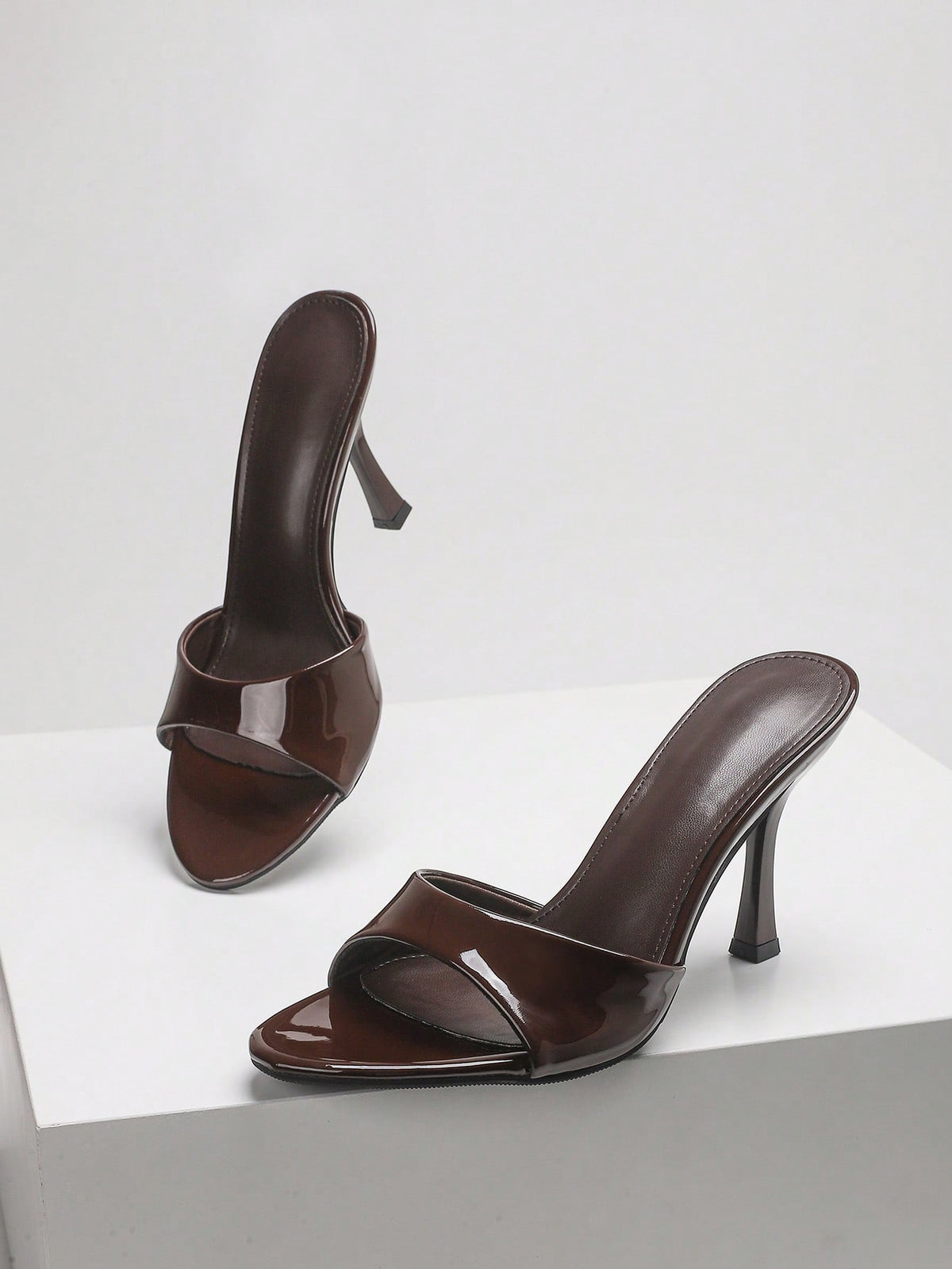 Women's open toe high heel sandals with slingback strap and sleek stiletto heel in smooth PU leather.