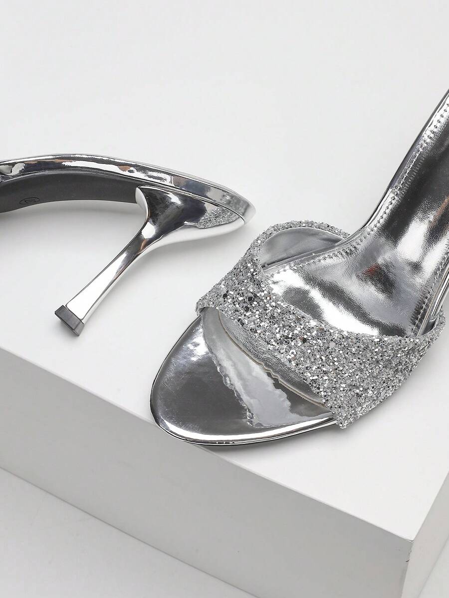 Women's open toe high heel sandals with slingback strap and sleek stiletto heel in smooth PU leather.