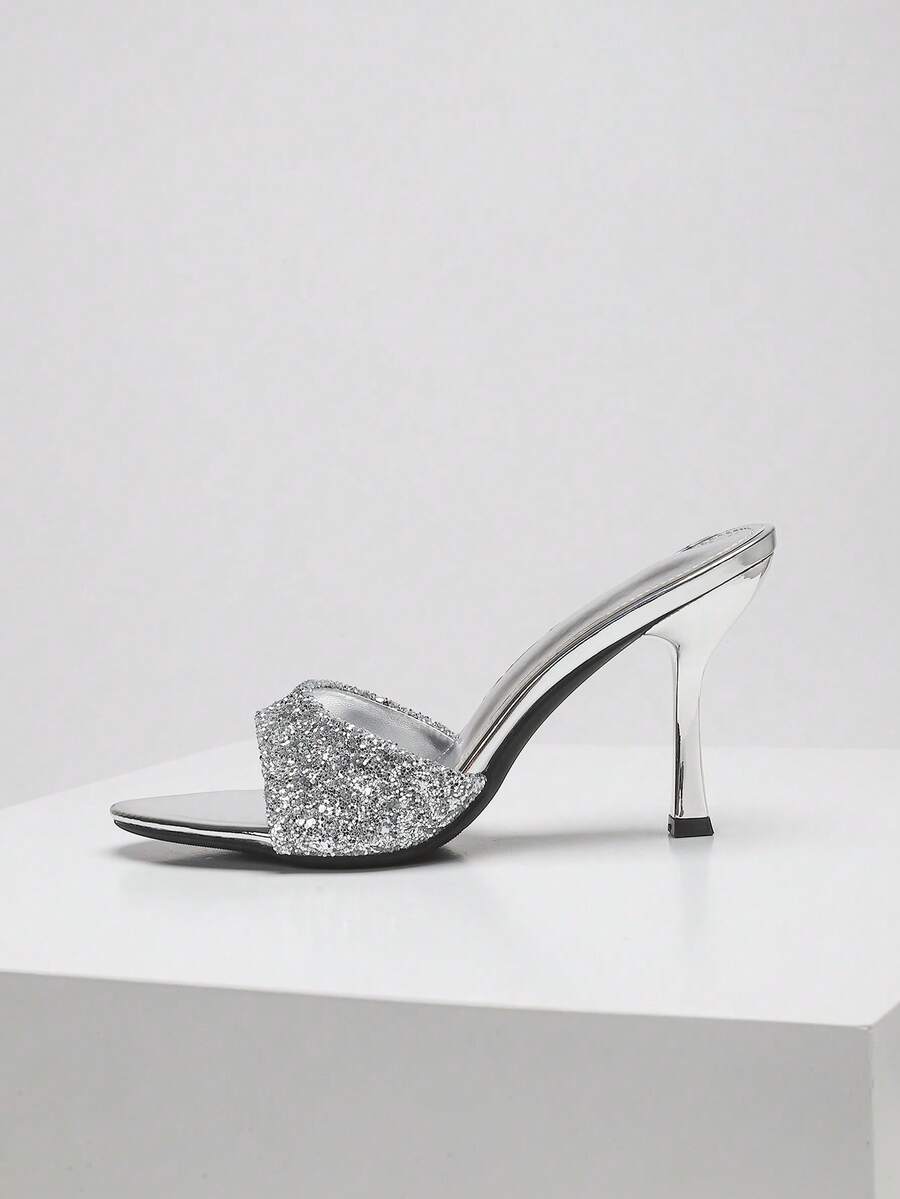 Women's open toe high heel sandals with slingback strap and sleek stiletto heel in smooth PU leather.