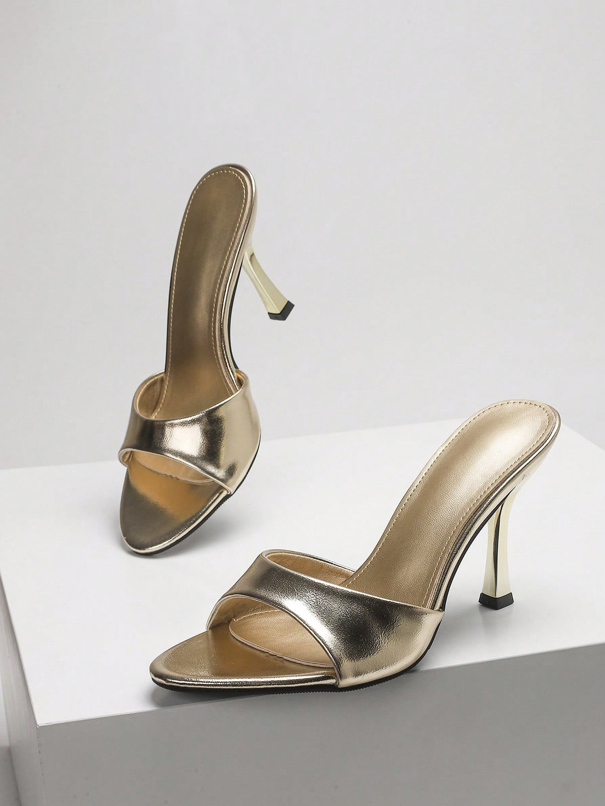 Women's open toe high heel sandals with slingback strap and sleek stiletto heel in smooth PU leather.