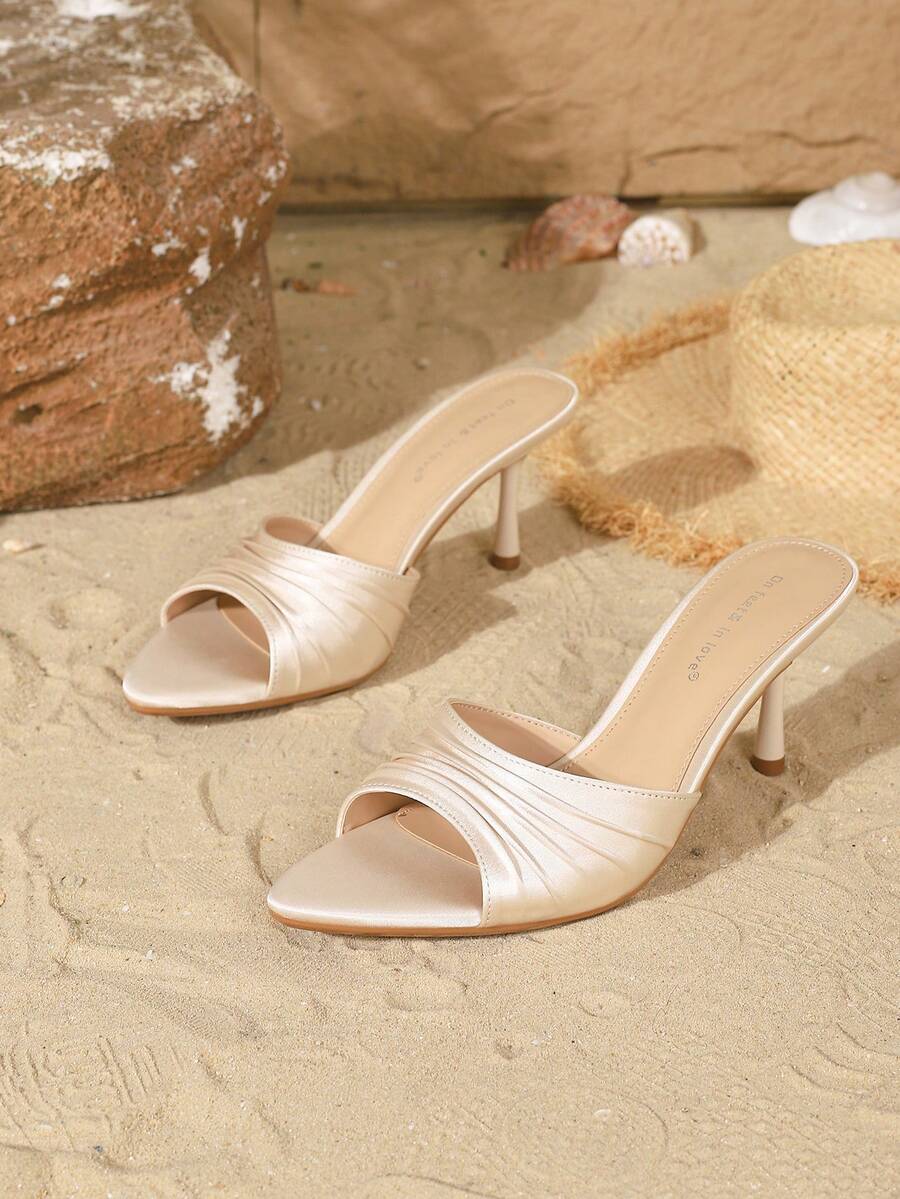 Women's open toe slip-on stiletto heel sandals featuring pleated satin design.