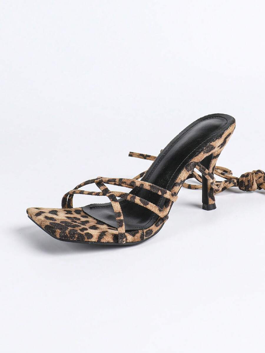 Square toe stiletto high heel sandals with criss-cross strappy lace-up design in leopard print.