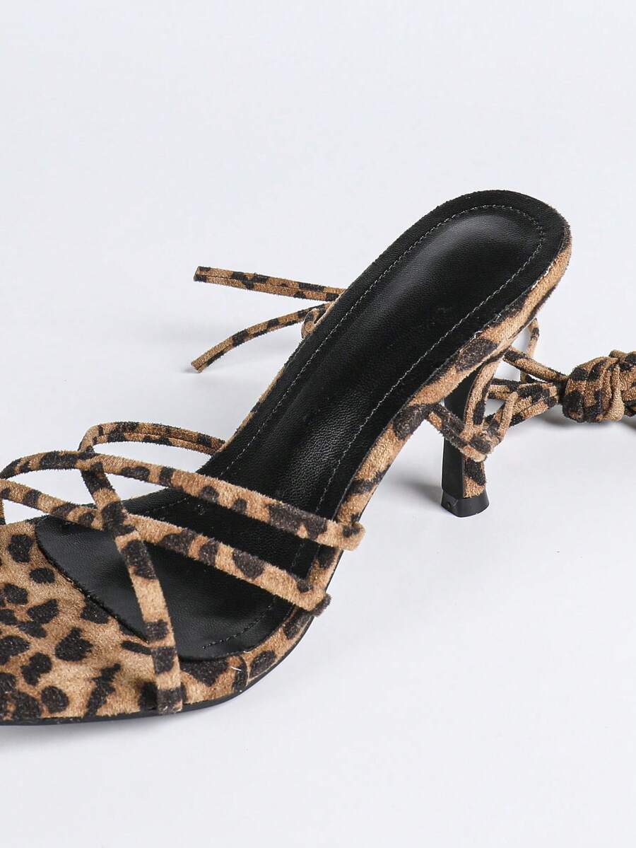 Square toe stiletto high heel sandals with criss-cross strappy lace-up design in leopard print.
