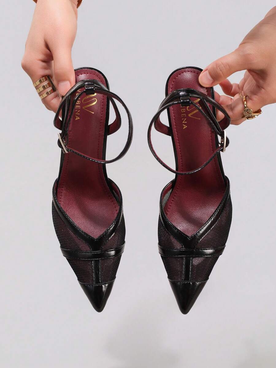 Lace embroidered high heels with thin stiletto heel, pointed toe, rhinestone embellishments, and ankle strap buckle closure.