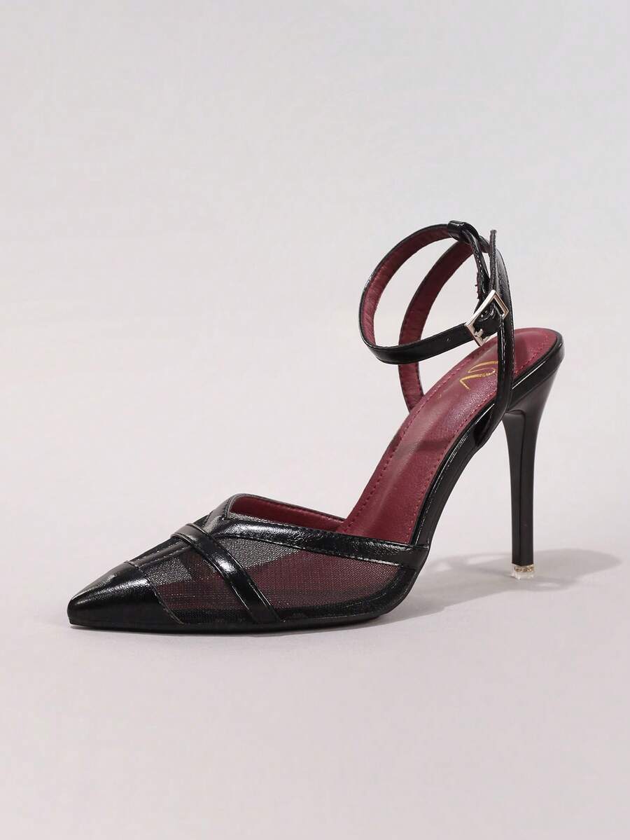 Lace embroidered high heels with thin stiletto heel, pointed toe, rhinestone embellishments, and ankle strap buckle closure.