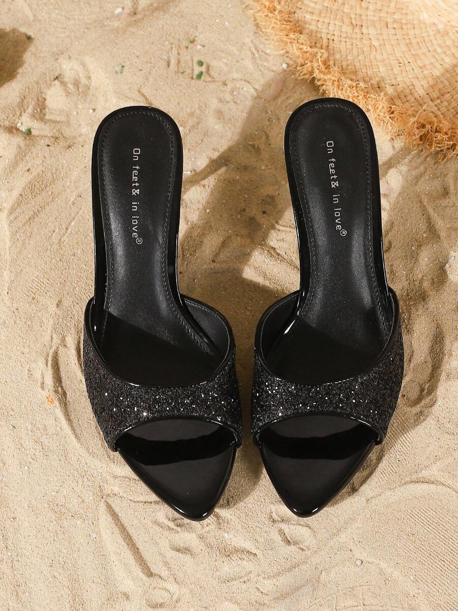 Women's open toe slide sandals featuring sleek patent leather and thin stiletto heels