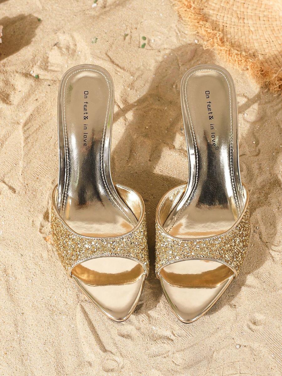 Women's open toe slide sandals featuring sleek patent leather and thin stiletto heels