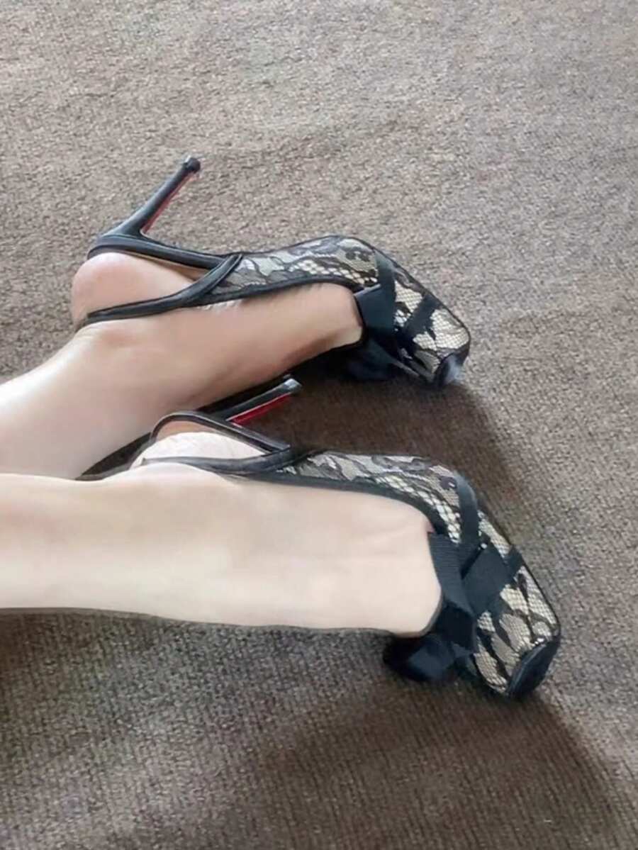 Black lace high heel sandals for women with a big bowknot, closed square toe, and stiletto heel.