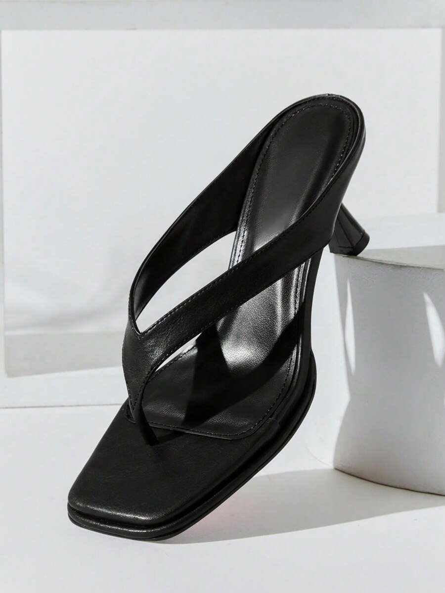Women's minimalist black PU leather thong heel sandals featuring kitten heels and rhinestone accents