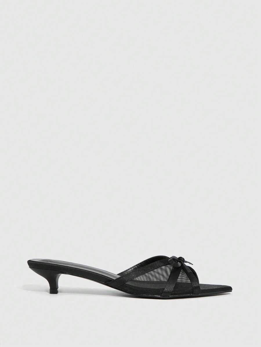 Pointed toe high-heeled slippers in PU leather with decorative buckle detail and low kitten heels for women.