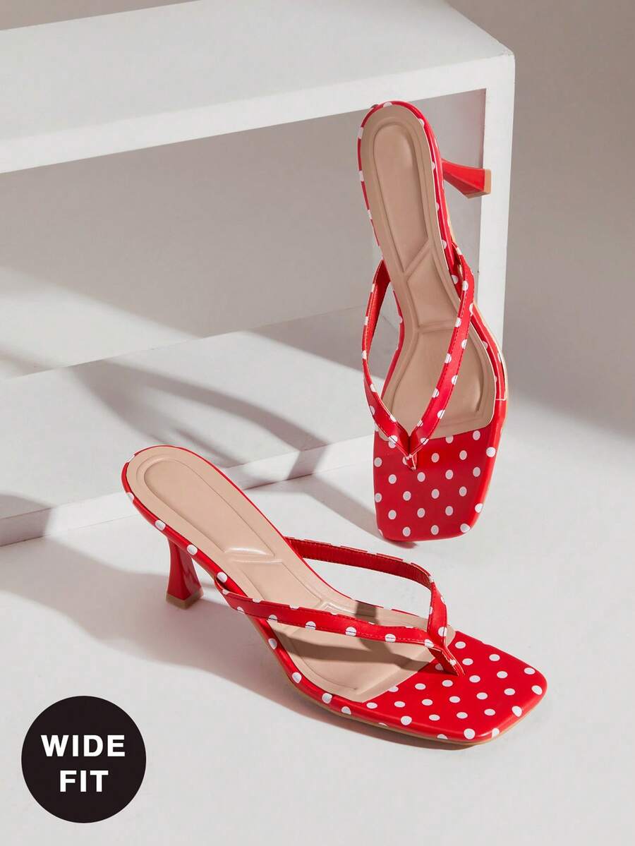 Women's square toe kitten heel thong heeled sandals featuring an asymmetrical strap design and mid heel