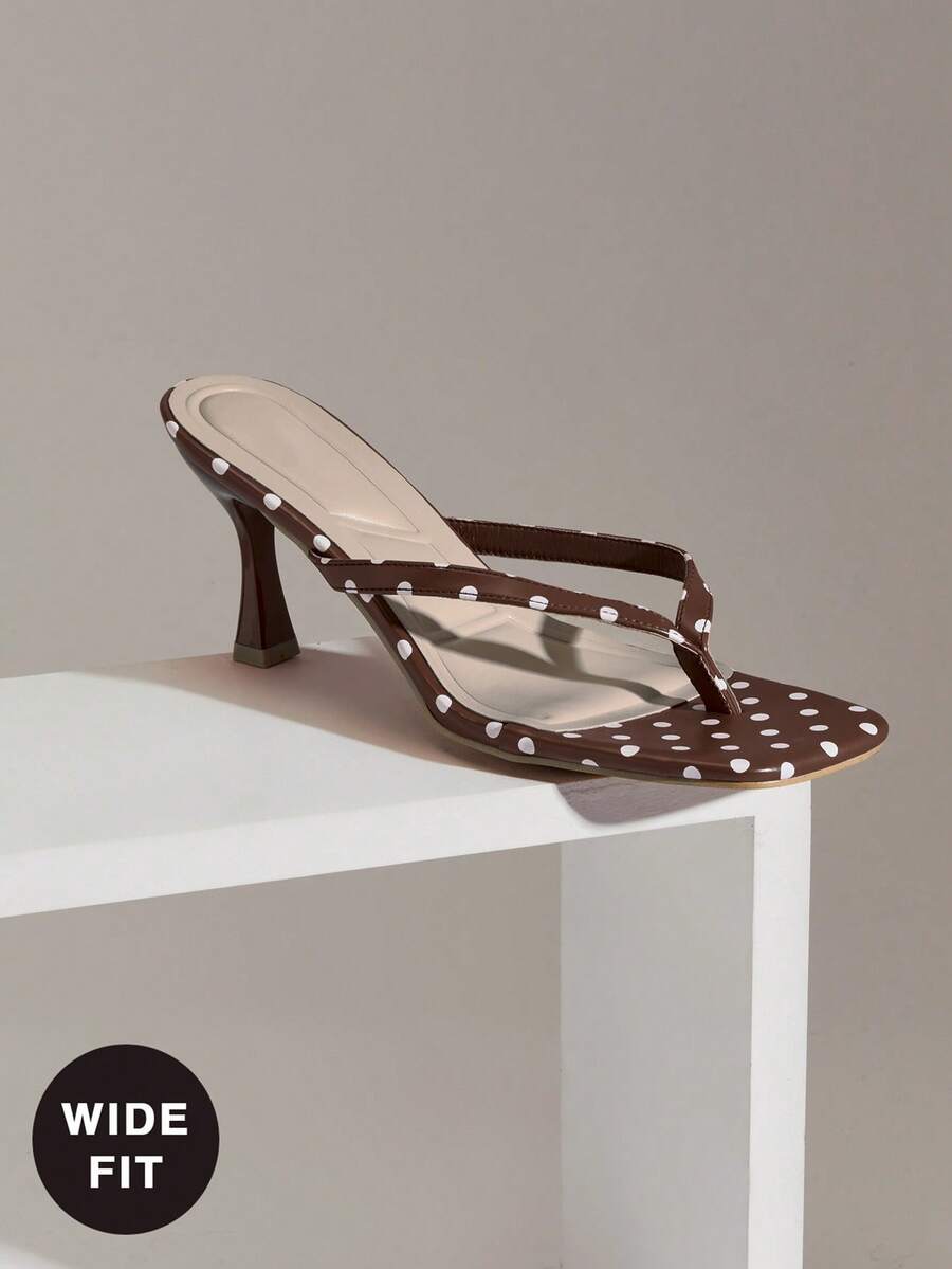 Women's square toe kitten heel thong heeled sandals featuring an asymmetrical strap design and mid heel