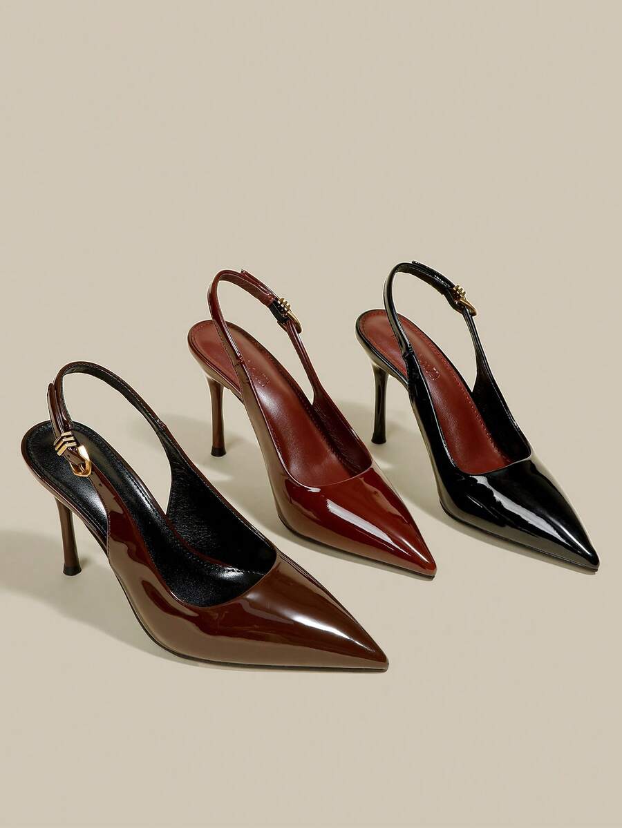 Women's pointed toe kitten heel pumps with adjustable buckle back strap and sleek patent finish.