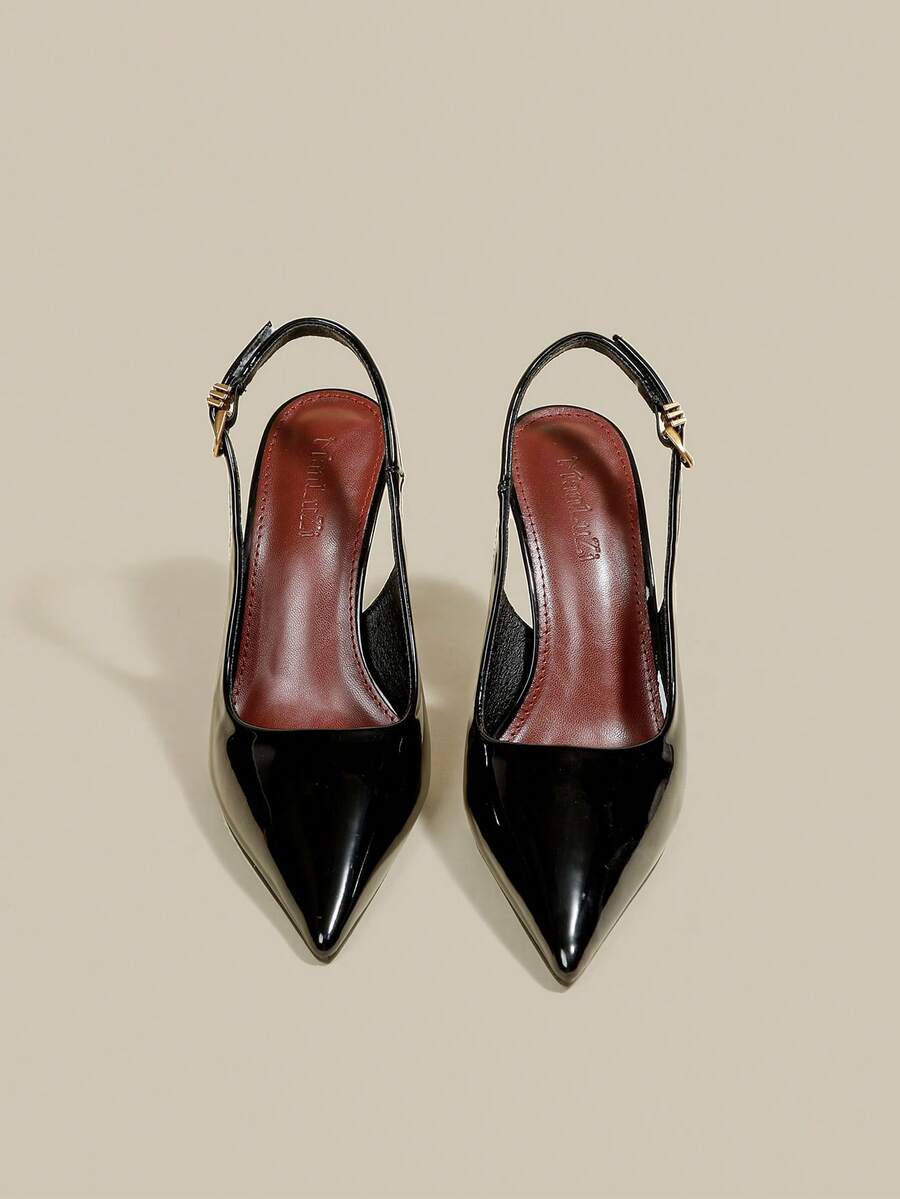 Women's pointed toe kitten heel pumps with adjustable buckle back strap and sleek patent finish.