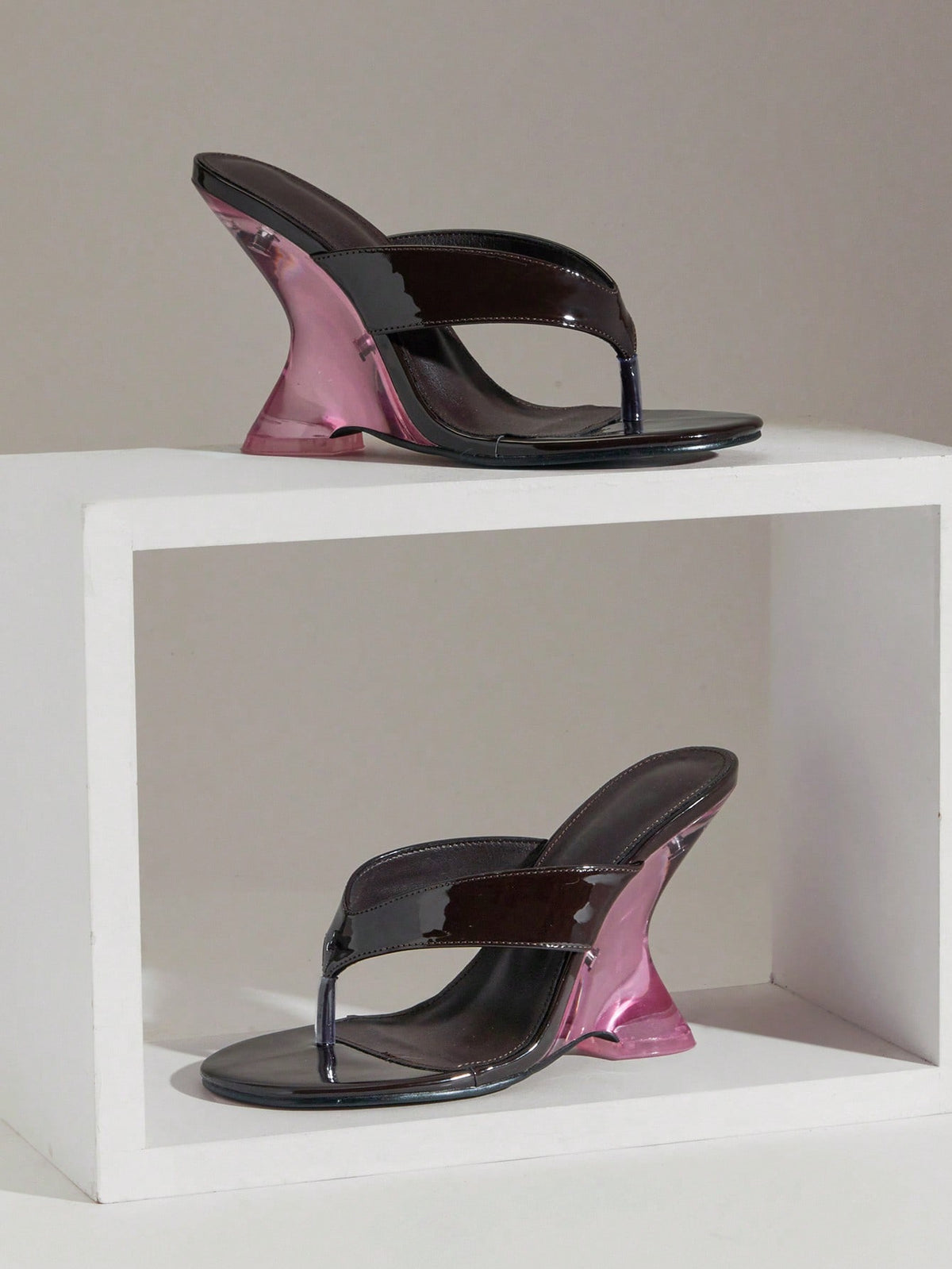 Women's slip-on thong strap wedge sandals featuring a high wedge heel and smooth PU leather upper.
