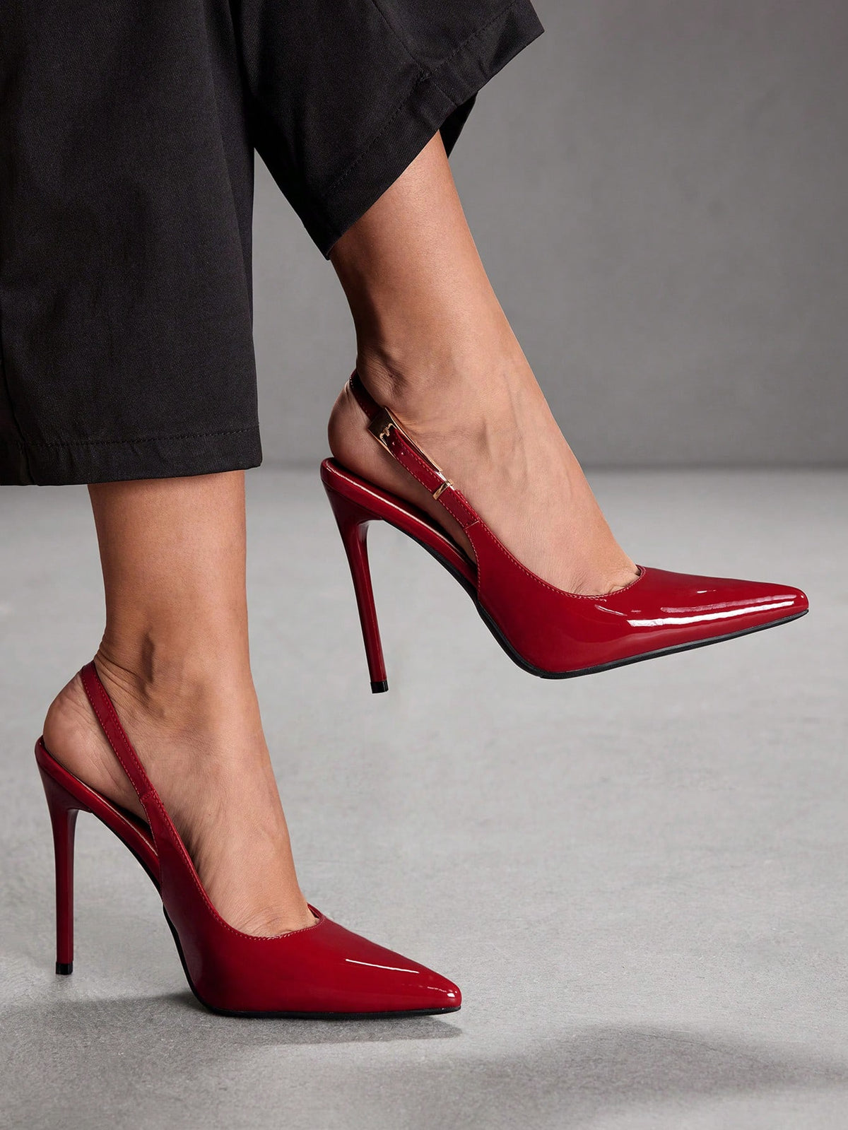 Pointed toe stiletto high heel evening party pumps featuring an ankle strap with buckle closure.