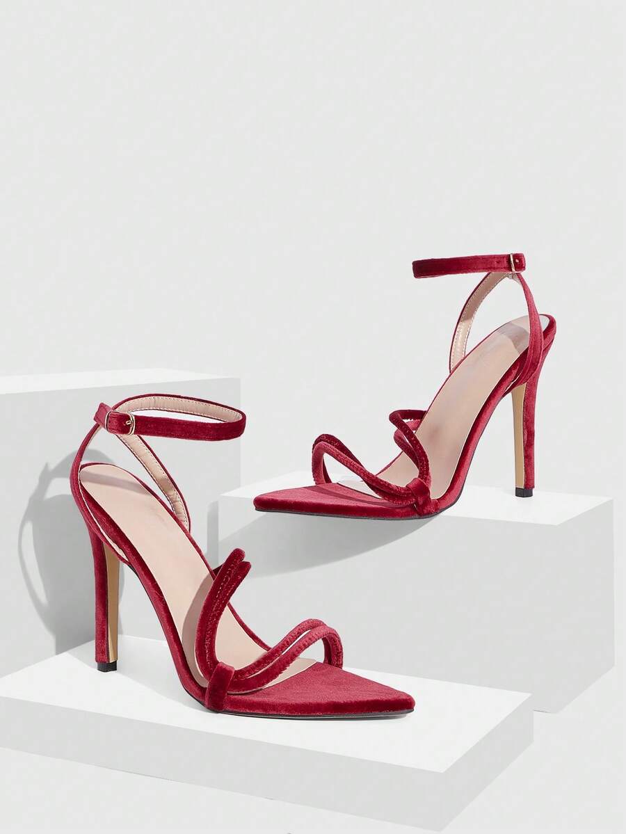 Snake pattern open toe high heel sandals with thin stiletto heel and buckle ankle strap for women.
