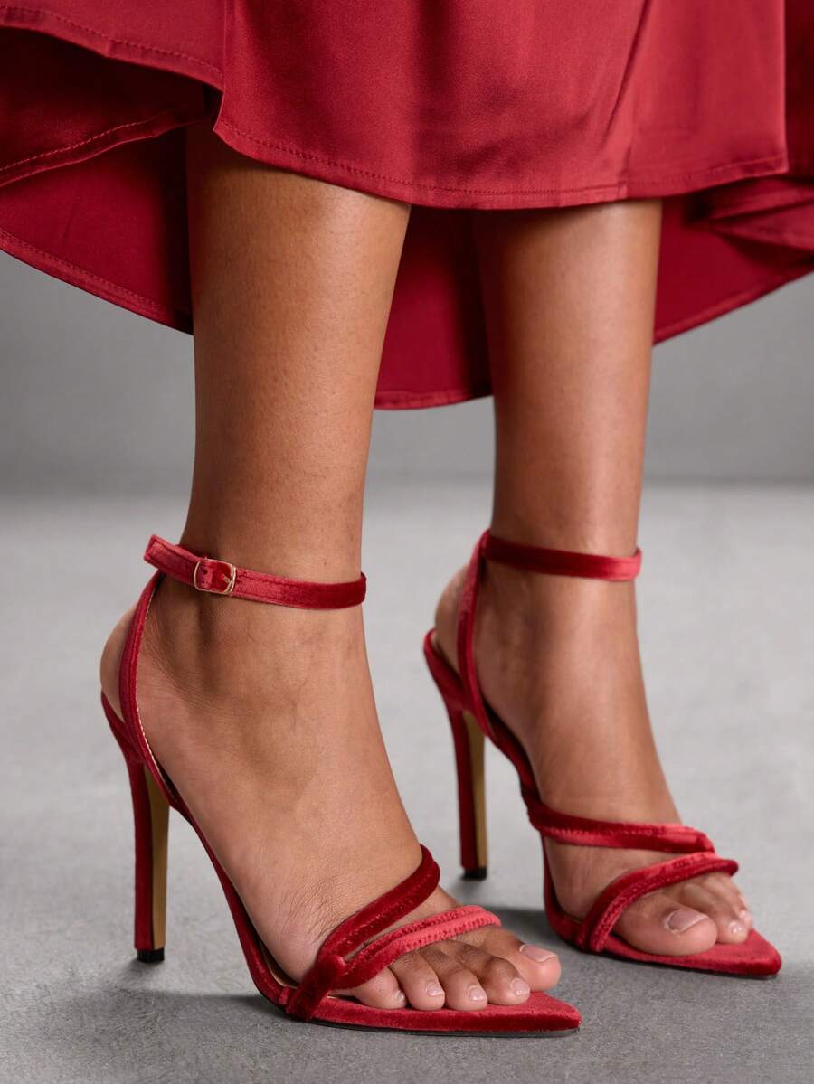 Snake pattern open toe high heel sandals with thin stiletto heel and buckle ankle strap for women.
