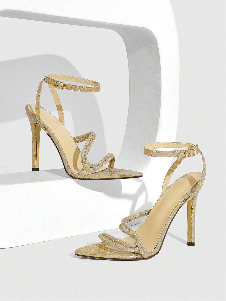 Snake pattern open toe high heel sandals with thin stiletto heel and buckle ankle strap for women.