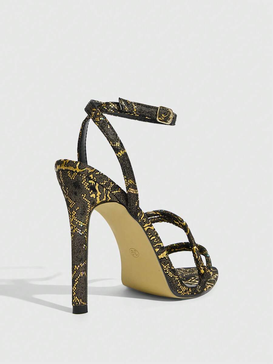 Snake pattern open toe high heel sandals with thin stiletto heel and buckle ankle strap for women.