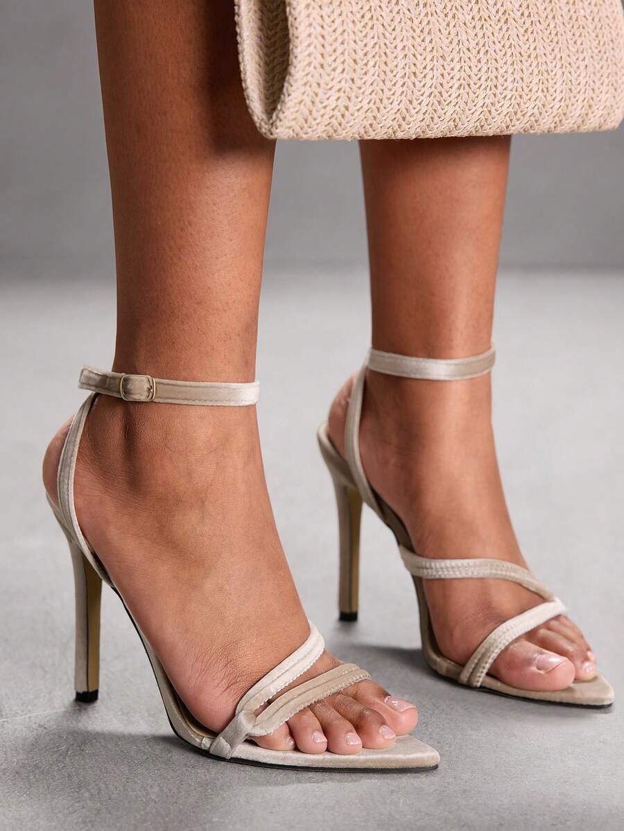 Snake pattern open toe high heel sandals with thin stiletto heel and buckle ankle strap for women.