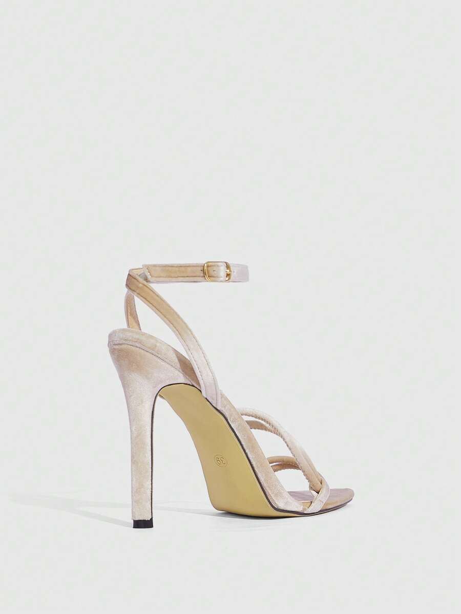 Snake pattern open toe high heel sandals with thin stiletto heel and buckle ankle strap for women.