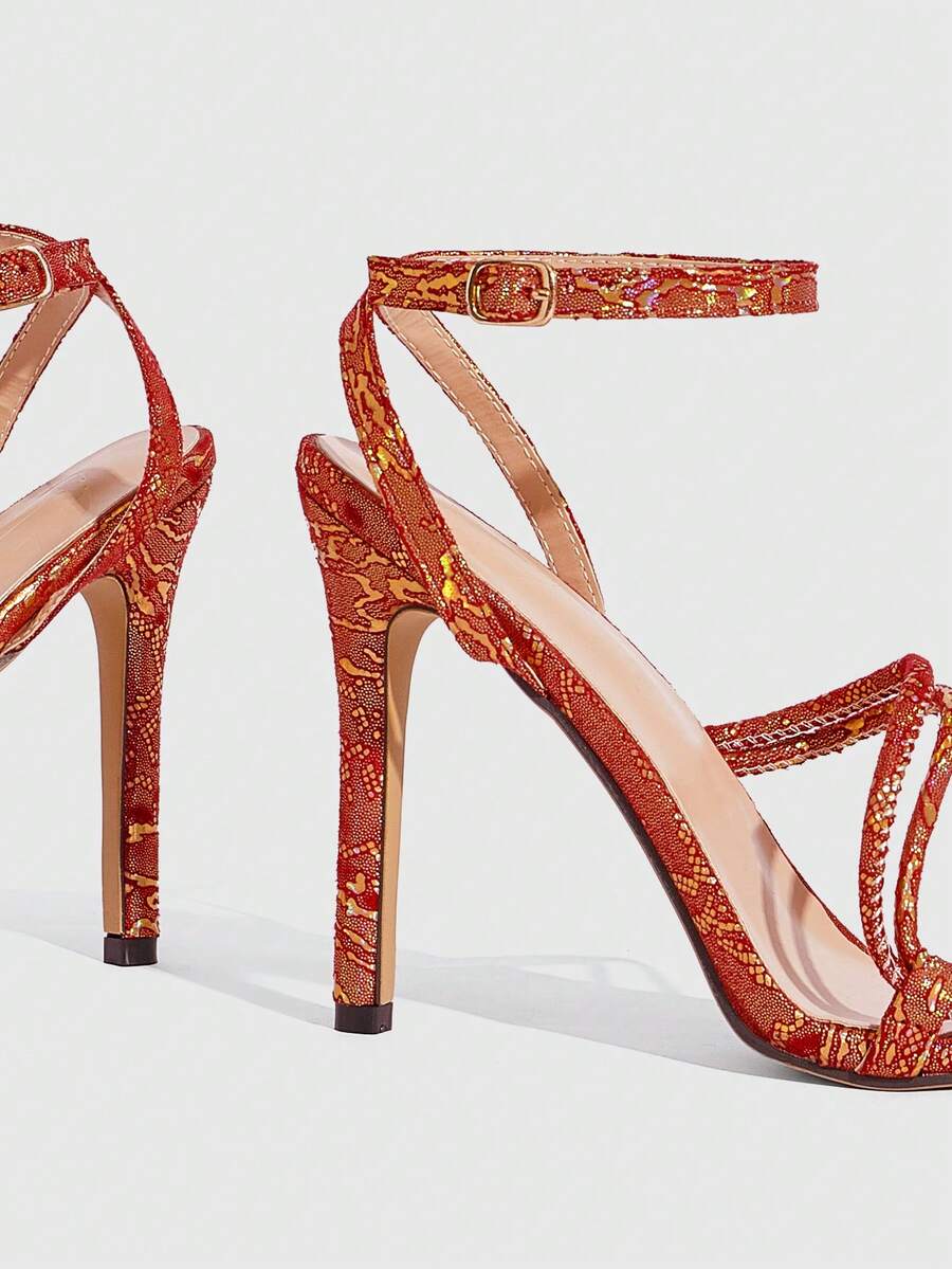 Snake pattern open toe high heel sandals with thin stiletto heel and buckle ankle strap for women.
