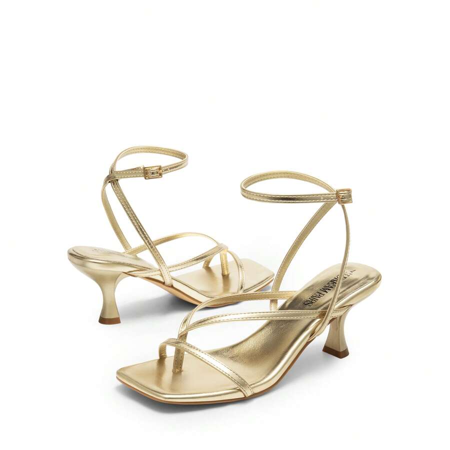 Pair of women's minimalist square toe kitten heeled thong sandals featuring slim ankle straps with buckle closure and sleek low heels.
