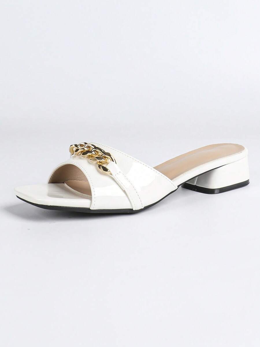 Women's multicolor square toe chunky heel sandals with bohemian textured pattern, canvas upper, and slip-on design.