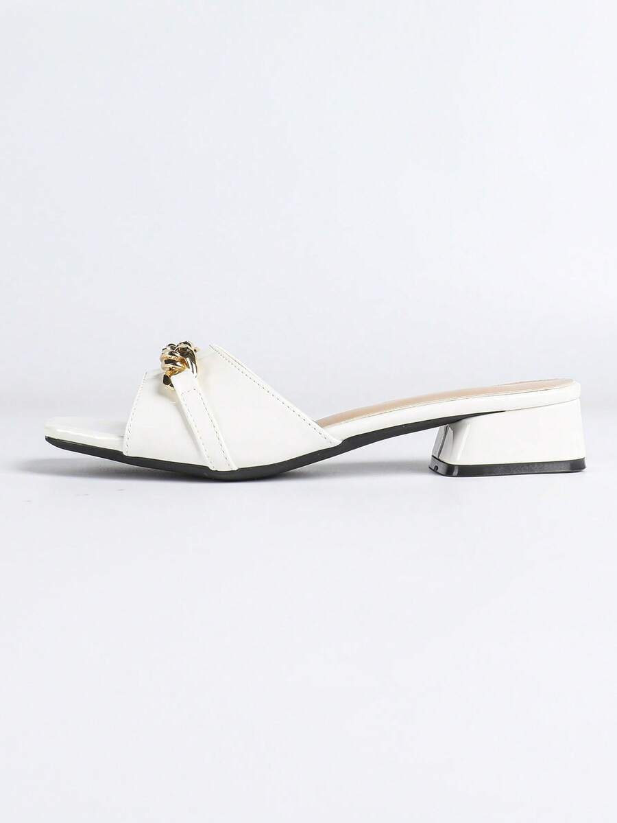 Women's multicolor square toe chunky heel sandals with bohemian textured pattern, canvas upper, and slip-on design.