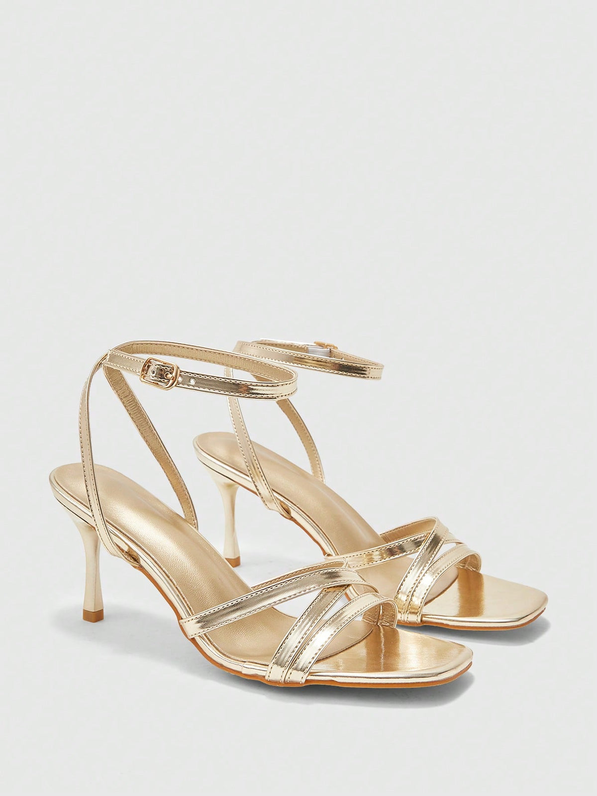Square toe stiletto high heel sandals with crisscross strappy design and adjustable ankle buckle strap in light blue.