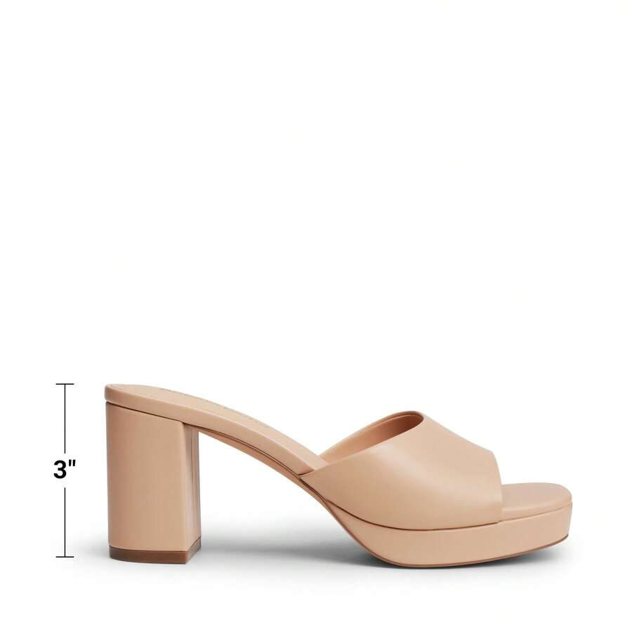 Women's minimalist open toe mule sandals featuring a chunky low heel, wide single strap, and slip-on design.