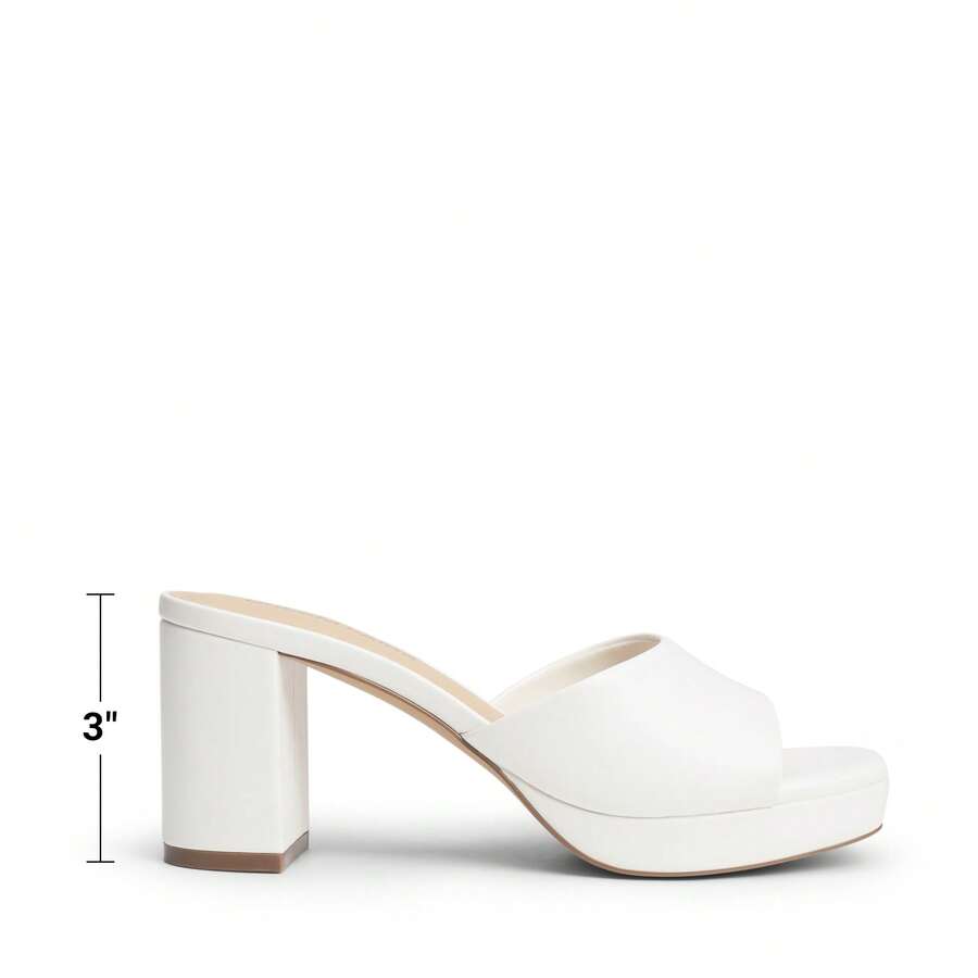 Women's minimalist open toe mule sandals featuring a chunky low heel, wide single strap, and slip-on design.