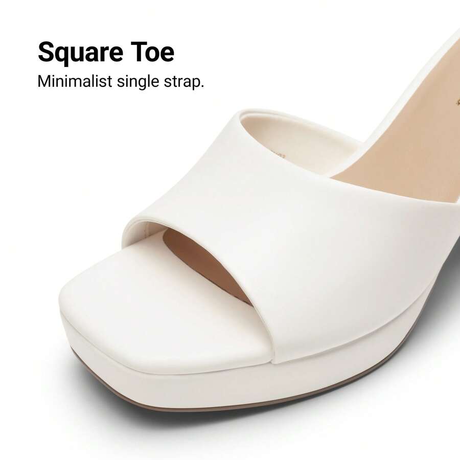 Women's minimalist open toe mule sandals featuring a chunky low heel, wide single strap, and slip-on design.