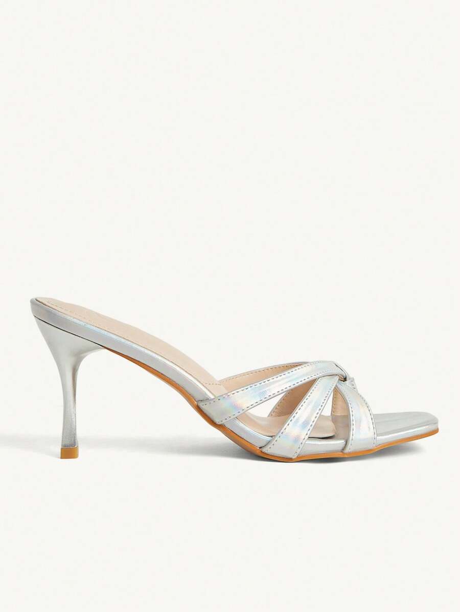 Square toe gold metallic heel sandals for women featuring open toe, crossover slingback strap, and stiletto mid heel for weddings and parties.