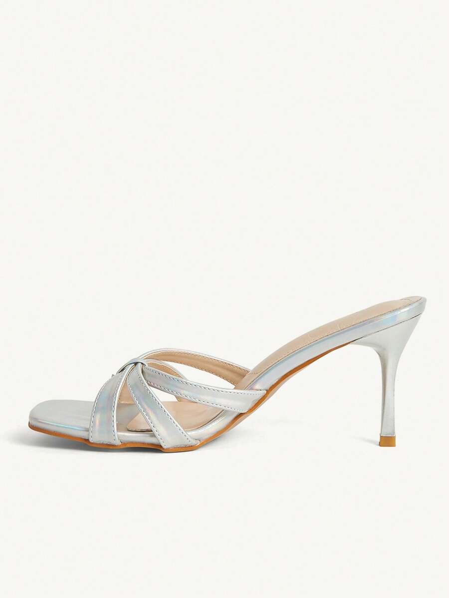Square toe gold metallic heel sandals for women featuring open toe, crossover slingback strap, and stiletto mid heel for weddings and parties.