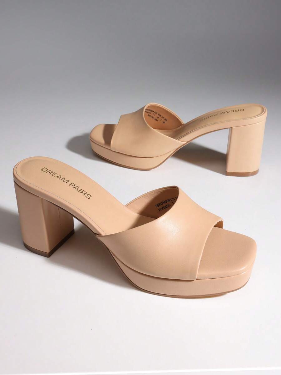Women's minimalist open toe mule sandals featuring a chunky low heel, wide single strap, and slip-on design.