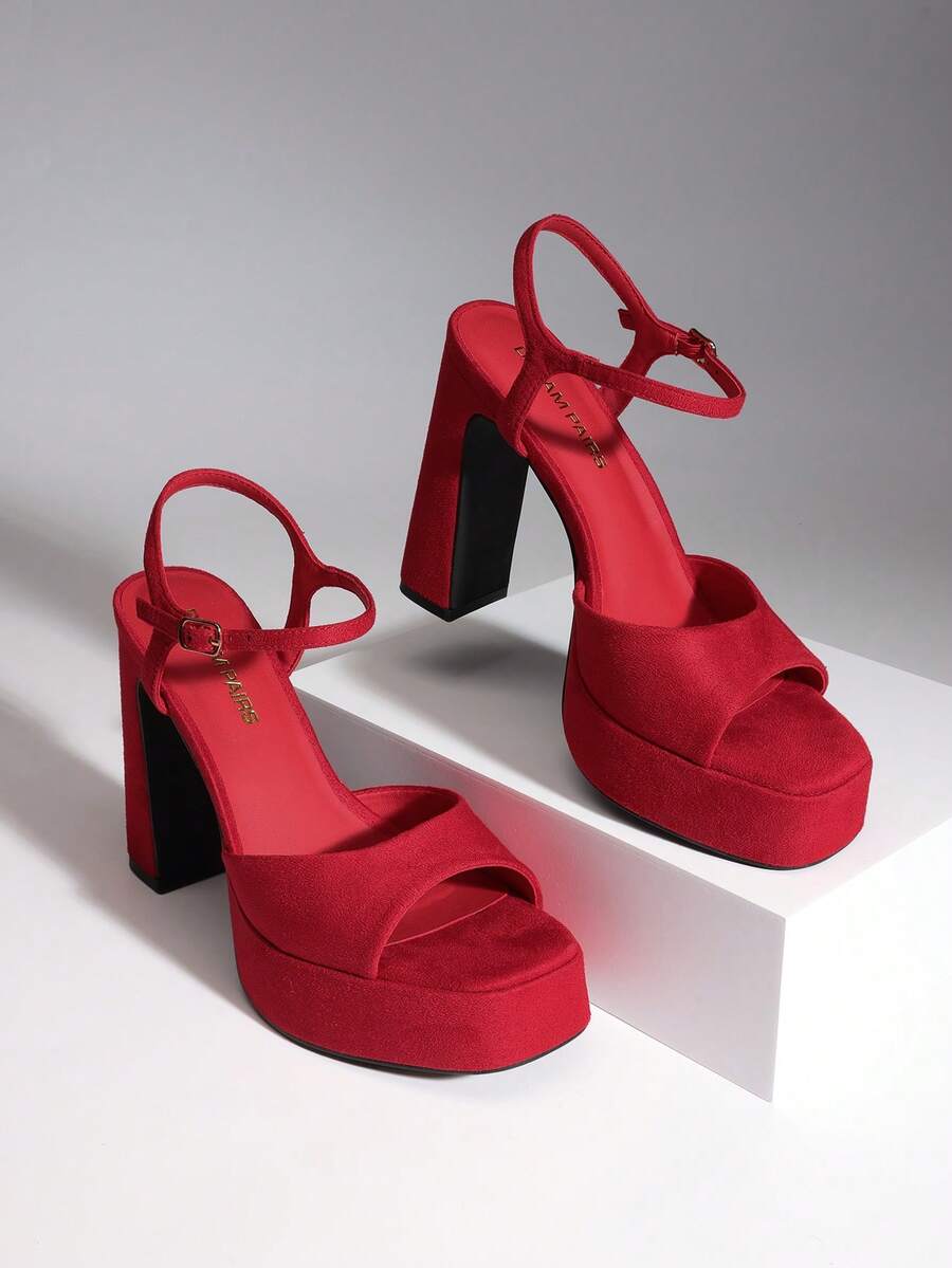 Women's open toe chunky high heel sandals featuring a platform sole, buckle ankle strap, and plain PU leather finish.
