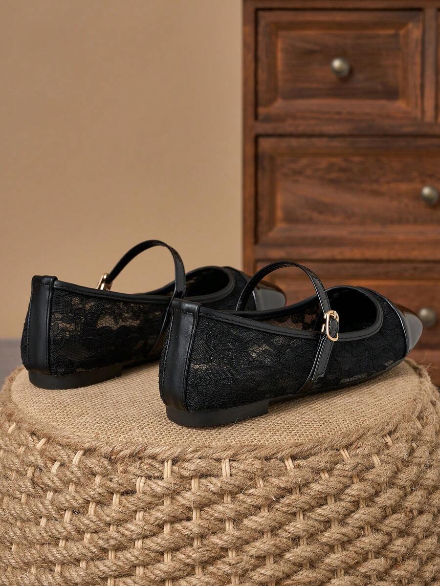 Pair of women's square toe slip-on flat shoes featuring a delicate bow detail and low vamp design.
