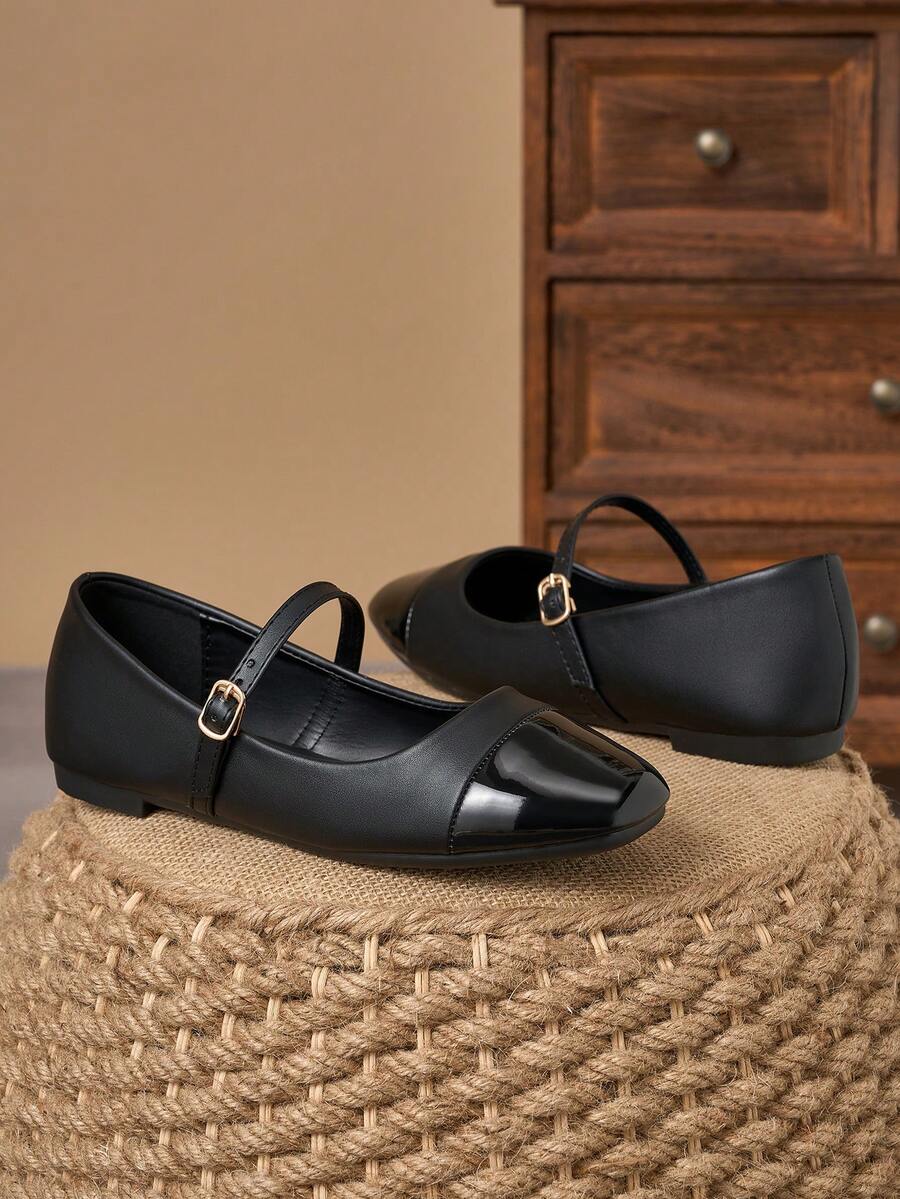Pair of women's square toe slip-on flat shoes featuring a delicate bow detail and low vamp design.