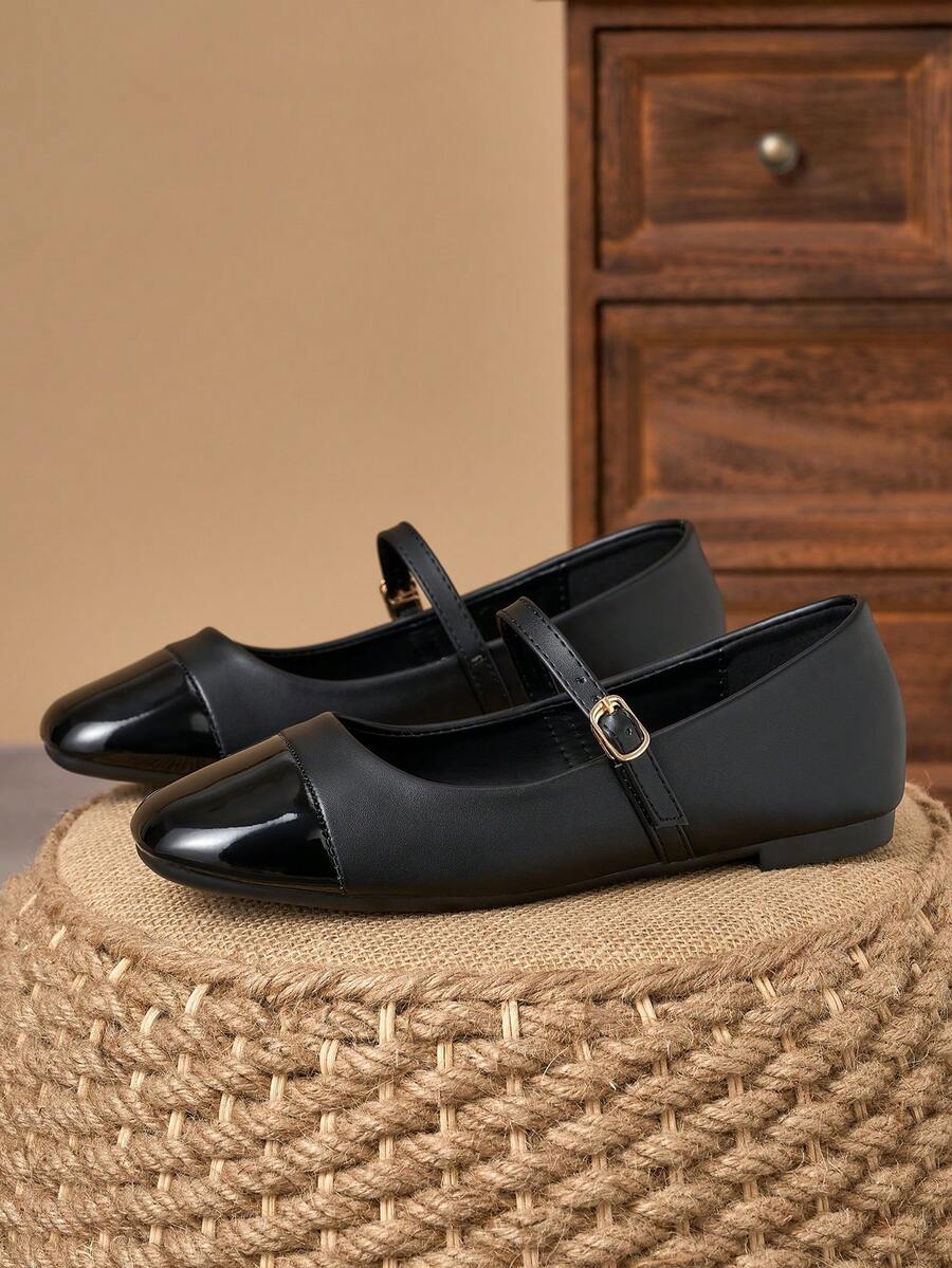 Pair of women's square toe slip-on flat shoes featuring a delicate bow detail and low vamp design.