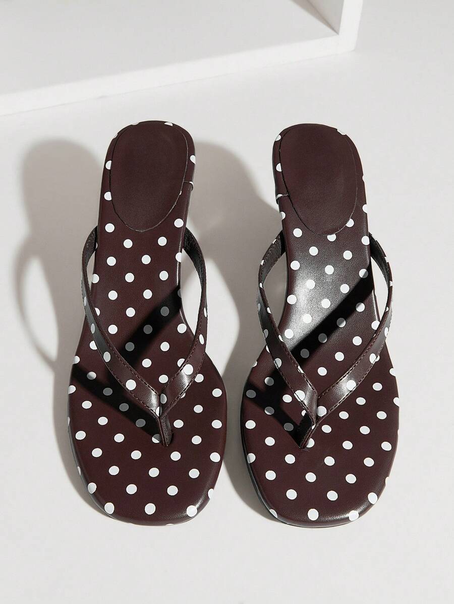 Women's minimalist black PU leather thong heel sandals featuring kitten heels and rhinestone accents