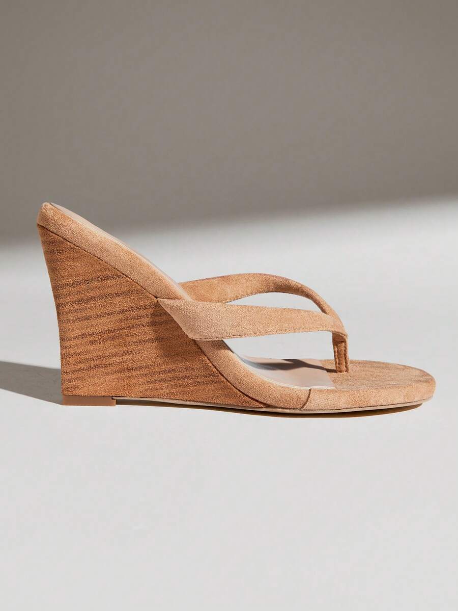Women's faux suede thong wedge sandals featuring rope detail and high platform wedge sole