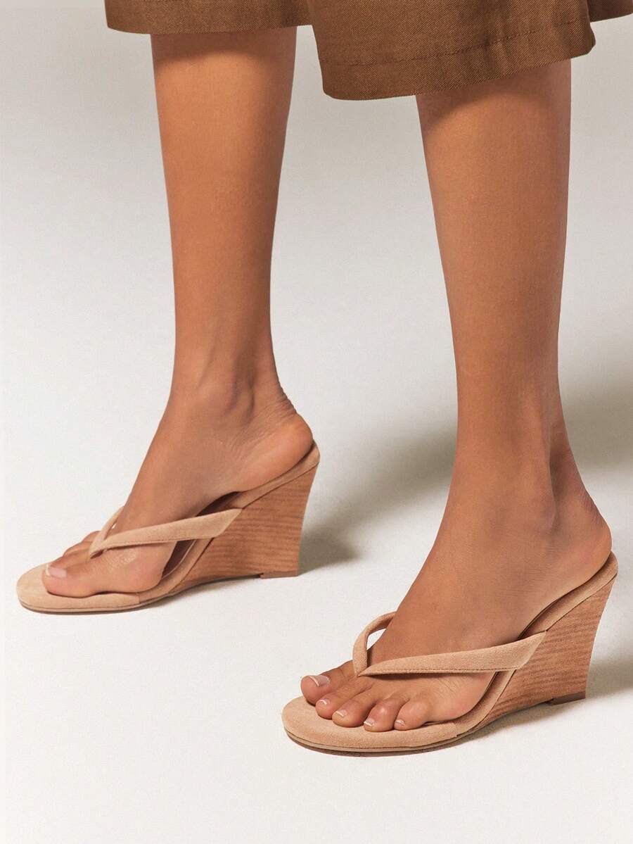 Women's faux suede thong wedge sandals featuring rope detail and high platform wedge sole