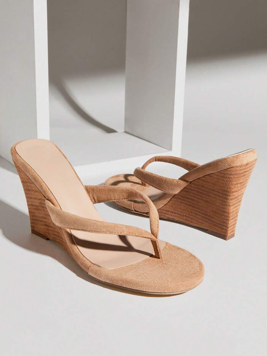 Women's faux suede thong wedge sandals featuring rope detail and high platform wedge sole