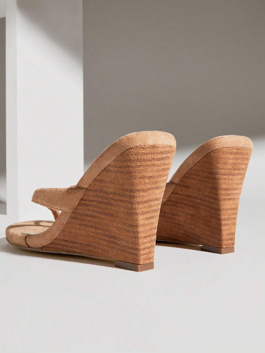 Women's faux suede thong wedge sandals featuring rope detail and high platform wedge sole