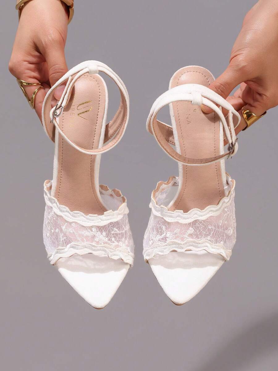 Lace stiletto high heel sandals with pointed open toe, ankle strap buckle, and bow detail