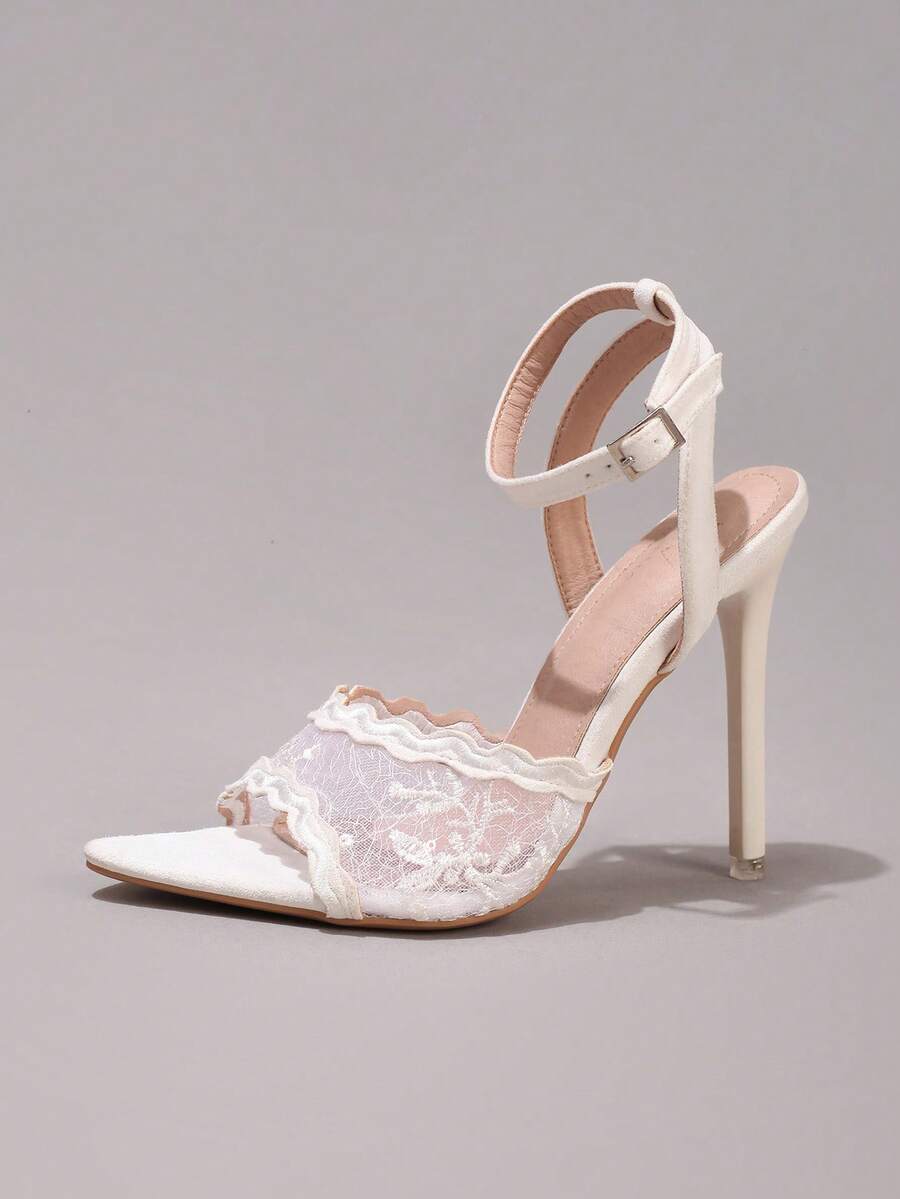 Lace stiletto high heel sandals with pointed open toe, ankle strap buckle, and bow detail